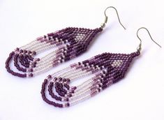 purple and white beaded earrings with spiral design