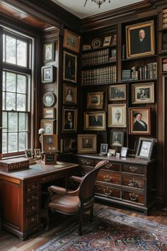 an old fashioned desk and chair in front of a bookshelf filled with pictures