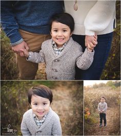 an adorable little boy is holding his mom's hand and smiling at the camera