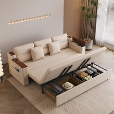 a living room with a couch, coffee table and drawers