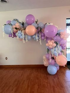 Bridgerton theme bridal balloon arch. Using baby blue, lavender, peachy pink balloons and adding in floral extra pieces for dimension. Fairy Balloon Arch, Bridal Balloon Arch, Bridgerton Theme, Sweet 13, Birthday 27, Balloon Designs