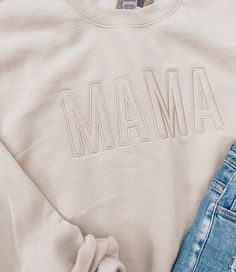 How adorable are these new Mama Embroidered Sweatshirts? 8 oz., 50% USA cotton, 50% polyester Pill-resistant air jet yarn Made with 50% sustainably and fairly grown USA cotton Cotton Sweatshirt With Embroidered Graphics And Relaxed Fit, Cotton Sweatshirt With Embroidered Graphics, Relaxed Fit, Cotton Sweatshirt With Embroidered Graphics In Relaxed Fit, Comfortable Cotton Sweatshirt For Spring, Basic Cotton Sweatshirt For Spring, Cotton Sweatshirt With Embroidered Text, Relaxed Fit, Relaxed Fit Cotton Sweatshirt With Embroidered Text, Trendy Tops With Custom Embroidery For Fall, Trendy Cotton Sweater With Letter Embroidery