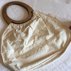 "Vintage 1970s Cotton Boho Bag. Muslin Cotton Lace and Purse With Oval Wooden Handles. Inside Pocket. Hippie Cloth Handbag. This cotton purse is in good shape. It looks like it was never used. It is unstained and beautiful. Size: 13 1/2\" X 9 1/2\", Handle: 7\" X 8\" For other vintage and homemade items see: www.VeryVictorianStudio.etsy.com For sewing related items see my other shop: www.SewingRoomStore.etsy.com Thank you for looking!" Vintage Summer Shoulder Bag, Vintage White Shoulder Bag For Beach, Vintage Beige Shoulder Bag For Summer, Vintage Cream Beach Bag, Vintage Shoulder Bag For Everyday Summer Use, Vintage Beige Shoulder Bag For Spring, Vintage Beige Bags For Summer, Retro Beige Shoulder Bag For Summer, Beige Retro Shoulder Bag For Summer