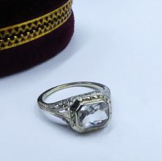 Antique Art Deco marked 10k white gold filigree & clear topaz/aquamarine? ring size 6, In good antique condition. The stone some scratch grom age, The pictures is part description.  Sold as is, The face of the ring 9 mm x 10 mm, Stone 8 mm x 6 mm. Weighs 2.4 gram. Thanks. Ship US only Victorian White Diamond Ring In Platinum, Victorian White Diamond Platinum Ring, Victorian Style White Diamond Platinum Ring, Antique White Diamond Filigree Ring, Formal Filigree Rings With Emerald Cut, White Hallmarked Diamond Ring Collectible, Diamond Filigree Ring With Gemstone For Formal Events, Diamond Filigree Ring With Gemstone For Formal Occasions, Emerald Cut Silver Topaz Ring For Wedding