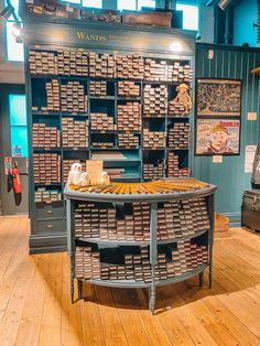 a display case filled with lots of different types of chocolates in a museum like setting