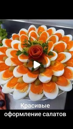 an orange and white flower made out of hard boiled eggs