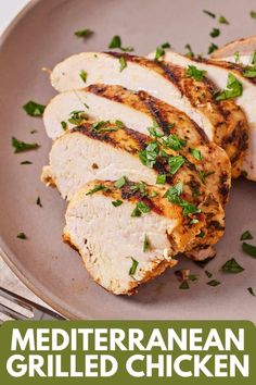 grilled chicken on a plate with parsley garnish and text that reads mediterranean grilled chicken