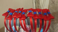 red, blue and silver hair combs with pictures on them