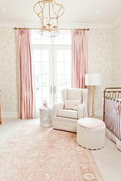 the baby room is decorated in pink and white