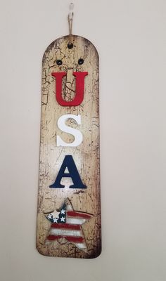 a wooden sign that says u s a with an american flag and stars on it