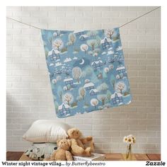 two teddy bears are sitting next to a baby carriage wall hanging on a clothes line