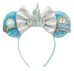 the disney mouse ears are decorated with blue and white designs, including an image of cinderella's castle