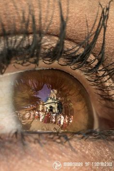 the reflection of a building in an eye