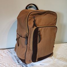 Tough Canvas With Great Hand Feel, Quality Materials, Tons Of Zippers Pockets And Compartments. Padded Interior Compartment For Laptop With Thick Velcro Stap. Bottle Holder (Bottle Not Included) Burks Bay Quality Casual Brown Bags With Zipper Pocket, Casual Light Brown Travel Bag, Casual Khaki Backpack With Zipper Pocket, Casual Beige Backpack With Zipper Pocket, Casual Brown Travel Bag With Pockets, Casual Beige Backpack With Zipper Closure, Casual Khaki Canvas Travel Bag, Casual Beige Travel Bag For School, Casual Travel Bag With Zipper Pocket