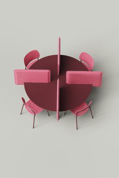 a round table with pink chairs around it