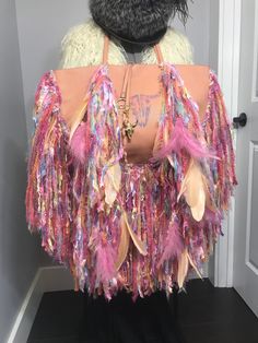 "This bag is a BCBG (new) to start with that has been upcycled and hand made by me. I loved making this into a one of a kind piece of art! The bag itself is a light peach, the fringe has all pastel colors which plays well with the bag itself. Their are 12 pink ostrich feathers and 12 peach goose feathers, at all of the feather tips are beautiful glass beads. I hand painted the goat skull and added a hand painted goat skull that you can take off and wear as a necklace or whatever you choose. The Pink Ostrich Feathers, Hummingbird Skull, Bottle Top Crafts, Goat Skull, Leather Fringe Bag, Novelty Yarn, Fur Headband, Vintage Fox, Boho Fringe