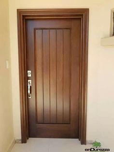 a wooden door with a phone on the side