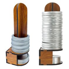 two stacks of silver and wood stacked on top of each other, with one stack in the middle