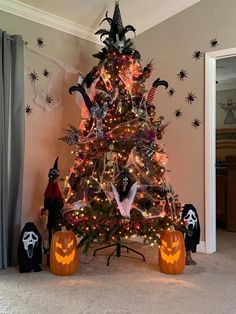 a decorated christmas tree with halloween decorations