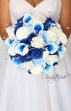 a bride holding a blue and white bouquet