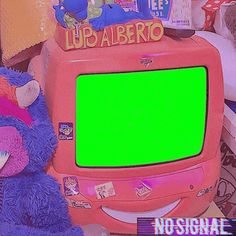 there is a pink tv with a green screen on it and a purple teddy bear next to it