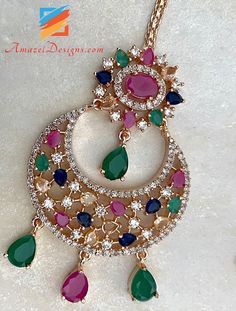 American Diamond (AD) Multicolored Earrings Tikka with small Jhumkis on the bottom. Available to shop online and delivered to your doorsteps anywhere in the world with our Everything-Everywhere FREE Shipping. 📦Unmatched FREE Worldwide Shipping EXPLORE more Maang Tikka Sets and Tikka Set Punjabi AMERICAN DIAMOND JEWELLERY Match with our pretty Single Line Necklaces Jaspreet, Canada ⭐️⭐️⭐️⭐️⭐️ Jewellery is more beautiful in real than the picture. Also, I received order within two days. I like the Multicolored Earrings, Maang Tikka Set, American Diamond Jewellery, Maang Tikka, Single Line, American Diamond, Diamond Jewellery, Diamond Jewelry, Statement Necklace