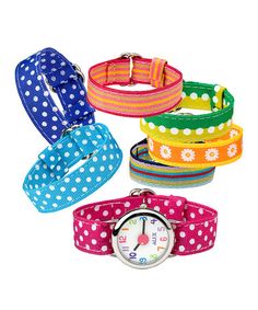 four different colored wrist watches with polka dot designs on each watch face and colorful straps