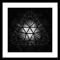 a black and white photo of a geometric structure