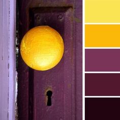 an orange is sitting on top of a purple doorknob with the word color in it