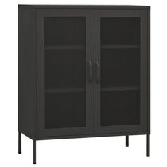 a black cabinet with mesh doors