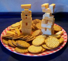 a plate with crackers and cheese on it