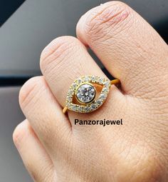 a woman's hand with a diamond ring on top of her finger and the words panorajewel above it