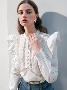 Experience a touch of elegance with Isabella Women's Pure Color Hollow Out Embroidered Shirt. This white plain shirt showcases a beautiful contrast lace and delicate ruffle details, creating an effortlessly chic look. Long flounce and leg-of-mutton sleeves, coupled with a stand collar, add a sophisticated twist to the comfortable loose fit. Crafted from non-stretch fabric, this versatile top is an indispensable addition to your refined wardrobe. SIZE + FIT Model is Wearing: S (UK8) Height: 177.0 / 69.7 Bust: 80.0 / 31.5 Waist: 61.0 / 24 Hips: 88.0 / 34.6 DETAILS + CARE Color: White Style: Elegant Pattern Type: Plain Type: Shirt, Top Details: Ruffle, Contrast Lace Neckline: Stand Collar Sleeve Length: Long Sleeve Sleeve Type: Flounce Sleeve, Leg-of-mutton Sleeve Length: Regular Fit Type: Lo Elegant Spring Cotton Lace Top, Chic Lace Top With Broderie Anglaise, Elegant Cotton Lace Top For Spring, Elegant Cotton Lace Top With Ruffles, Feminine Blouse With Broderie Anglaise, Feminine Lace Work Blouse For Daywear, Elegant White Cotton Lace Top, Elegant Fitted Lace Top With Broderie Anglaise, Chic Broderie Anglaise Lace Top