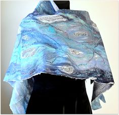 Hand felted elegant Merino wool & silk scarf for woman. Authentic design. Dominate blue  & white colors. *Quality Merino wool fiber *Silk *Natural, pure threads of silk *100 % handmade *Created and made in Lithuania *Easy care The scarf is hand washable in warm water with mild shampoo or silk/wool detergent. Squeeze gently. Drying: on a flat surface. Ironing: silk/wool setting, with use of steam. * * * * * * * * * * * * * * * * * * * * * #bestgift #bluescarf #wifegiftidea #finalsale #giftideafor Elegant Handmade Blue Scarves, Elegant Scarf, Woolen Scarves, Elegant Scarves, White Scarf, Spring Clothes, White Scarves, Scarf For Women, Handmade Scarves