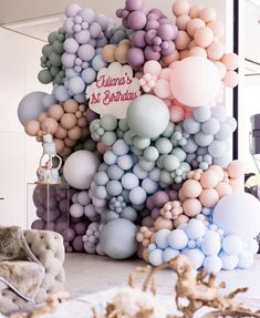 there is a large balloon wall in the room