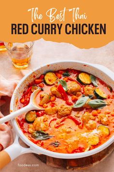 the best thin red curry chicken recipe in a white pan with spoons on top