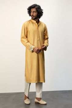 Yellow long kurta with thread embroidery all over and printed cuffs. Paired with a white dhoti pant. - Aza Fashions Traditional Long Sleeve Kurta With Embroidered Cuffs, Long Sleeve Kurta With Embroidered Cuffs For Eid, Eid Long Sleeve Kurta With Embroidered Cuffs, Festive Long Sleeve Lawn Suit With Embroidered Border, Traditional Wedding Kurta With Embroidered Cuffs, Long Sleeve Jamawar Kurta With Embroidered Border, Festive Cotton Kurta With Embroidered Cuffs, Traditional Straight Kurta Set With Embroidered Cuffs, Traditional Set With Straight Kurta And Embroidered Cuffs