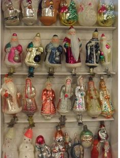 a shelf filled with lots of glass figurines