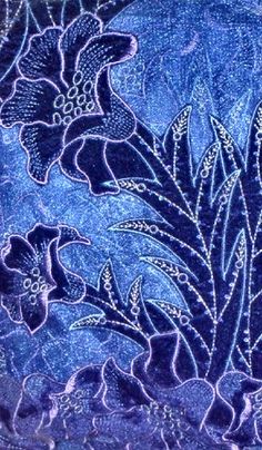 a blue cloth with flowers and leaves on it