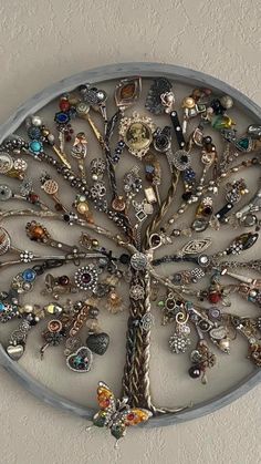 a metal tree with lots of charms on it