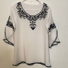 New/Flawless No Tags Found White Fabric That Feels Like Cotton/Blue Embroidery As Shown 3/4 Length Sleeves Tunic Length Size S/M Pit To Pit 19” Length 26” Boho, Tunic,Free Spirit, Feminine,Lightweight,Embroidered,Casual, White Embroidered Blouse With 3/4 Sleeves, White Floral Embroidered 3/4 Sleeve Blouse, White Blouse With Floral Embroidery 3/4 Sleeve, Blue Floral Embroidery Blouse With 3/4 Sleeves, Blue Blouse With Floral Embroidery And 3/4 Sleeves, Embroidery Designs Fashion, Boho Blouse, Blue Embroidery, Source Unknown