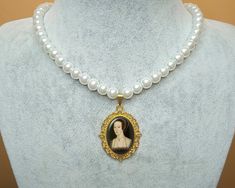 "Get 25% off when you buy 2 or more items using code \"sale 25\" *Anne Boleyn Pendant Necklace With Glass Pearl Beads *Necklace length 16.5 + 2 inches (42 + 5 cm). The pendant is resistant to tarnish. 8 mm quality glass pearl was used. *Picture print is placed inside the pendant and it is covered with resin. The resin is shiny and hard like glass. It is water and scratch resistant. *I make jewelry on order. Since it takes 24 hours for the resin to dry and harden, I ship your cargo 1-2 days after your order. If there are ready ones, I will ship them the same day. *I am sending your cargo in a small package in a bubble envelope. If you want to buy it as a gift, I can add your note to the package. You can write your note when ordering or send me a message after ordering. *If you want to have Anne Boleyn Necklace, Pearl Beads Necklace, Necklace With Pearl, Queen Art, Medieval Jewelry, The Tudors, Anne Boleyn, Make Jewelry, Beads Necklace