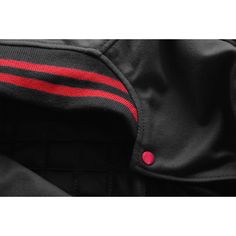 a black jacket with red stripes on it