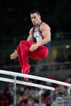 a man is doing tricks on the bars