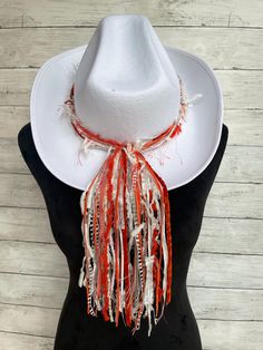 Tennessee Volunteers game day spirit wear! This vibrant hat band will add a festive splash of color to a variety of hats all throughout the year!  This hat band will make quite the statement worn on any color hat!   Made with unique specialty yarn of beautiful colors and textures, each band comes pre knotted to fit the standard size hat of 24" but the back knot can be untied and adjusted if needed.  The tail part of this hat band measures 10 inches.  If a different tail length is desired please Adjustable White Hat Band For Fall, Artistic Hat Bands For Festivals, White Fall Hat, One Size Fits Most, Adjustable White Hat For Game Day, Spring Yellow Adjustable Hat Bands, Traditional Adjustable Multicolor Hat Bands, Traditional Hat Bands For Festivals, One Size Fits Most, Red Western Style Hat Band, One Size Fits Most, Tennessee Volunteers