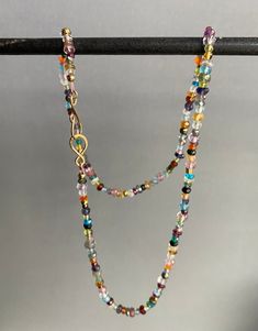 This multi gemstone necklace features bright and stunning natural stones strung on silk thread. It ends with a gold filled handmade hook and eye clasp. Each necklace will be created just for you! Multicolor Gemstone Beads Lariat Necklace, Multicolor Lariat Necklace With Gemstone Beads, Multicolor Gemstone Beaded Lariat Necklace, Artisan Multicolor Crystal Gemstone Necklace, Elegant Handmade Rainbow Beaded Necklaces, Spiritual Multicolor Lariat Beaded Necklace, Multicolor Lariat Beaded Necklaces With Natural Stones, Multicolor Multi-strand Necklace For Healing, Spiritual Multicolor Single Strand Crystal Necklace