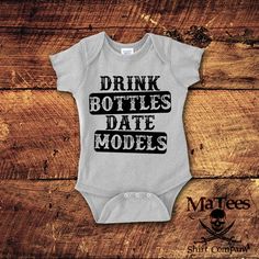 Thank you for checking out our "Drink Bottles Date Models" bodysuit. We At MaTees take great pride in the fact that we make our Products in Michigan. All orders are made and shipped ASAP but please be patient with larger or custom orders. Please feel free to message us with any questions comments or concerns. Thank you so much!▄▄▄▄▄▄▄▄▄▄▄▄▄▄▄▄▄▄▄▄▄▄▄▄▄▄▄▄▄▄▄▄▄▄▄▄▄▄▄▄▄▄▄▄▄▄▄▄▄▄SIZING INFORMATION:Rabbit Skins Infant Creeper (one piece):NB6mo12mo18mo24moRabbit Skins Toddler T-Shirt2T = 12" Width • Funny Fitted Onesie For Gender Reveal, Fitted Funny Onesie For Gender Reveal, Fitted Onesie With Name Print For Parenting, Fitted Onesie With Letter Print For Gender Reveal, Fitted Cotton Bodysuit For Gender Reveal, Aunt Baby Clothes, Newborn Boy Coming Home Outfit, Baby Aunt, 21st Birthday Shirts