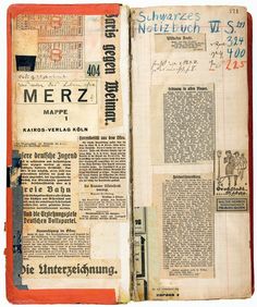 an open book with old papers on the pages and some writing in german, including letters