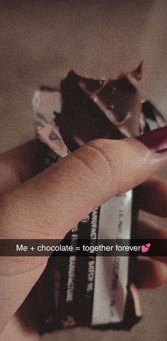 someone is holding a chocolate bar in their left hand with the caption me + chocolate = together forever