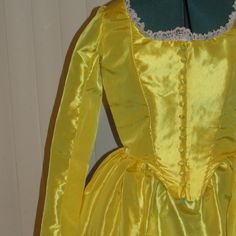 This listing is for a READY TO SHIP SIZE 14 - See below for measurement information. YOU MUST MEASURE YOURSELF PRIOR TO CHOOSING A SIZE** This two-piece costume is made in two pieces (a gown and a skirt) in gorgeous yellow taffeta.  The fully lined bodice is lightly boned and the neckline is lace-trimmed.  The full-length, two-piece fitted sleeves are accented with white lace.   The front has hook and eye closures covered by decorative fabric buttons.  The skirt is gathered and attached to the bodice to form the gown.  The underskirt has a waistband with a hook and eye closure and a zipper closure at the back.  A bum roll is recommended but NOT included.  The gown and skirt are both hand-hemmed.  All seams that are not enclosed are finished. BODY MEASUREMENTS for the TEENS/WOMENS sizing ar Princess Style Fitted Corset Dress For Costume Party, Fitted Princess Corset Dress For Costume Party, Fitted Princess Style Corset Dress For Costume Party, Fitted Dresses For Cosplay And Fantasy Events, Fitted Long Sleeve Princess Victorian Dress, Fitted Long Sleeve Victorian Princess Dress, Fitted Bodice Costume For Cosplay And Fantasy Events, Fitted Princess Victorian Dress Costume, Fitted Princess Style Victorian Dress Costume